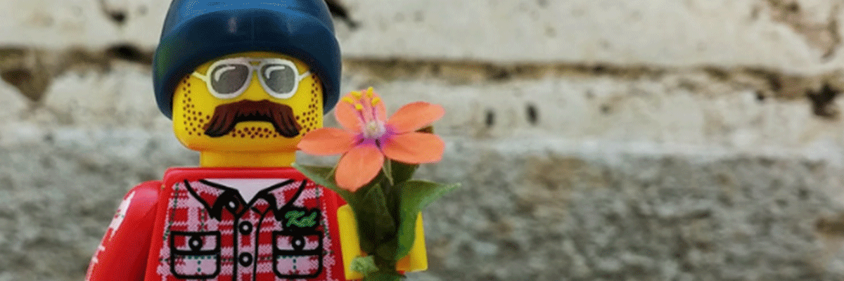 Lego character handing you a flower.