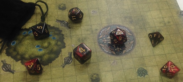 red polyhedral dice scattered on a fantasy battlemap
