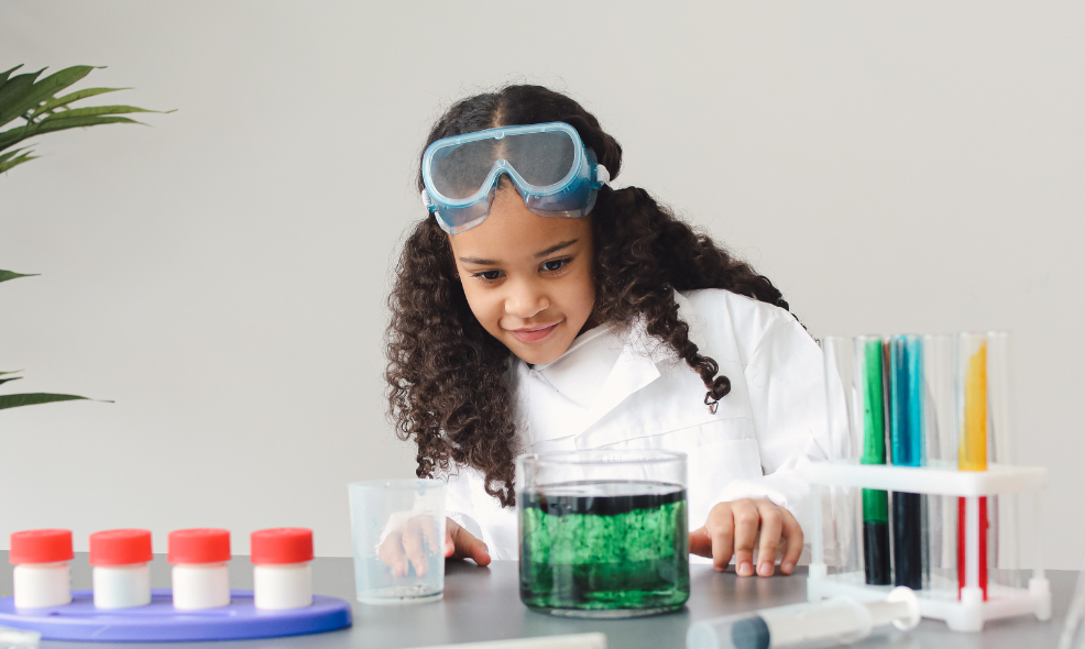Young child doing science experiment